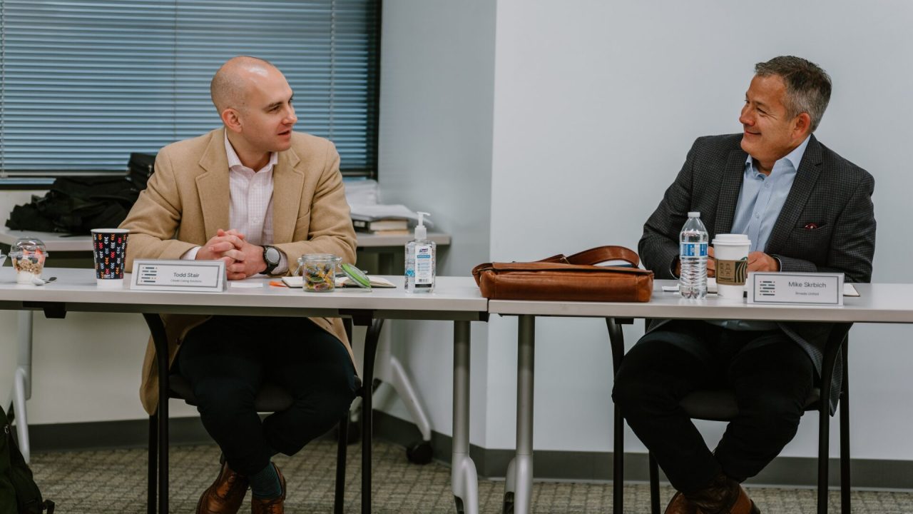 Two Rmada United students talking with each other and smiling