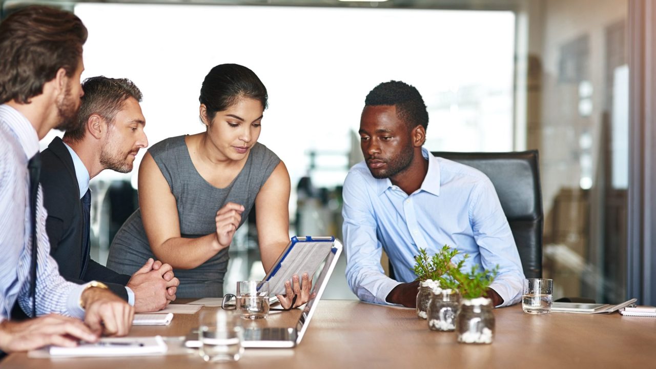 shot-of-a-group-of-corporate-colleagues-talking-to-2025-04-05-22-15-03-utc Daily stand-up meeting improving team communication
